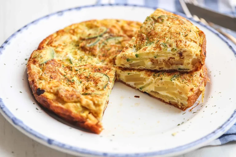 Spanish-style chicken, potato, and zucchini tortilla on a plate